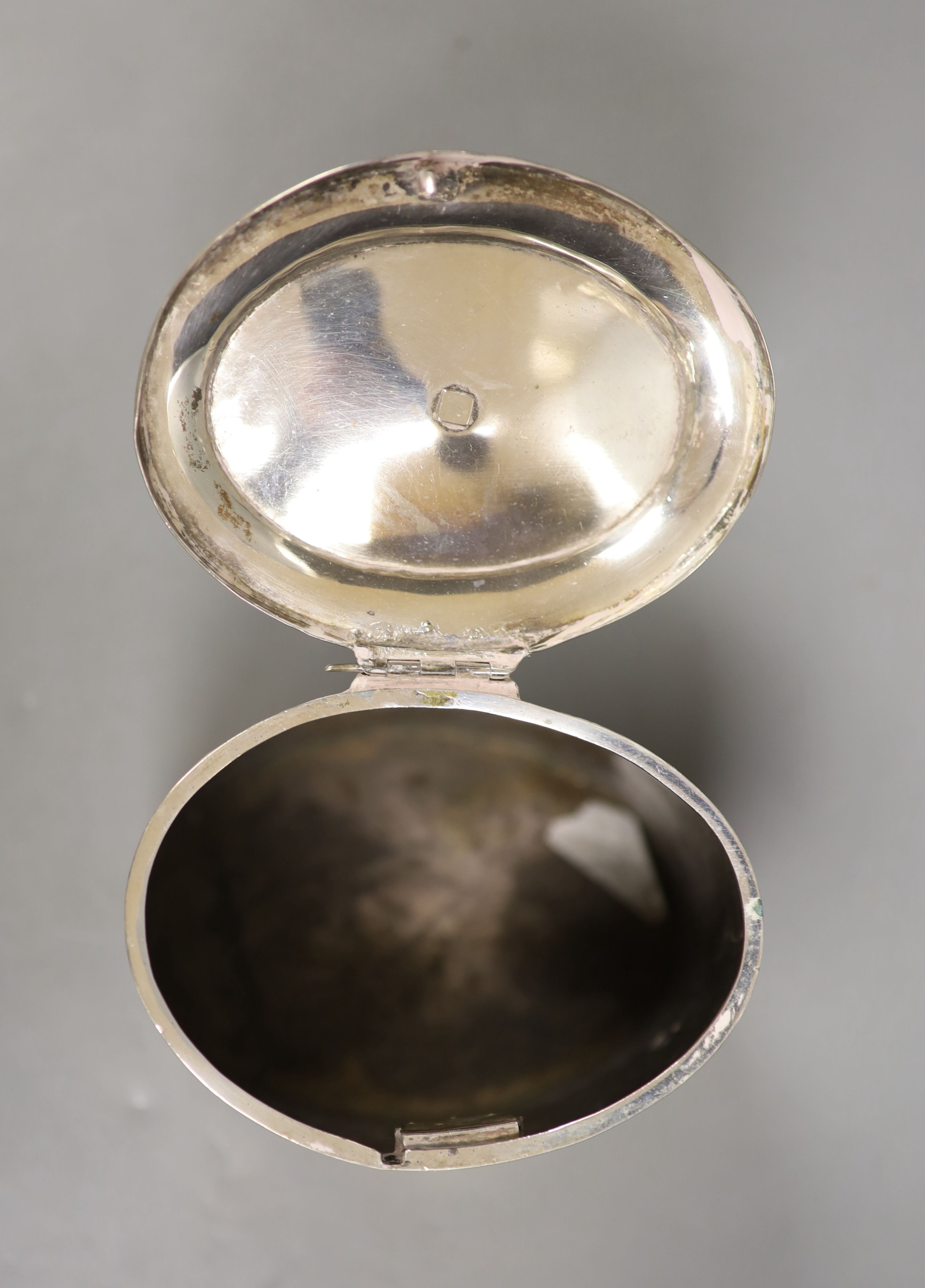 A 19th century Dutch white metal oval tea caddy, height 11.3cm, with lock, no key, 9oz.